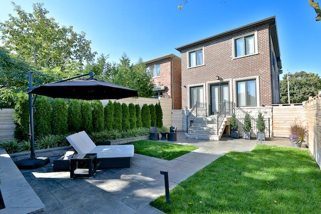 contemporary patio and fence, cedars, retaining wall, wrought iron railings